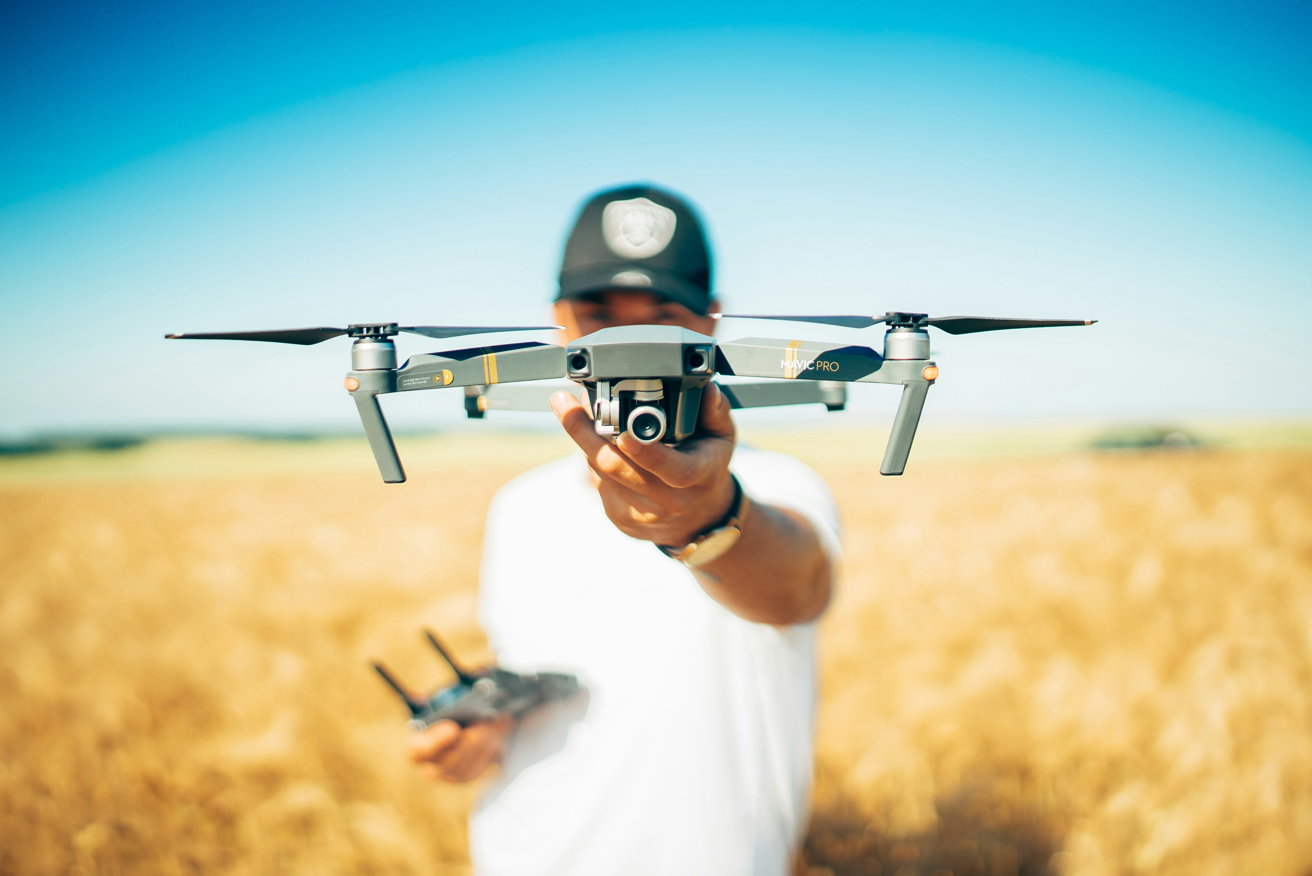 Operator reviewing aerial footage on a tablet outdoors